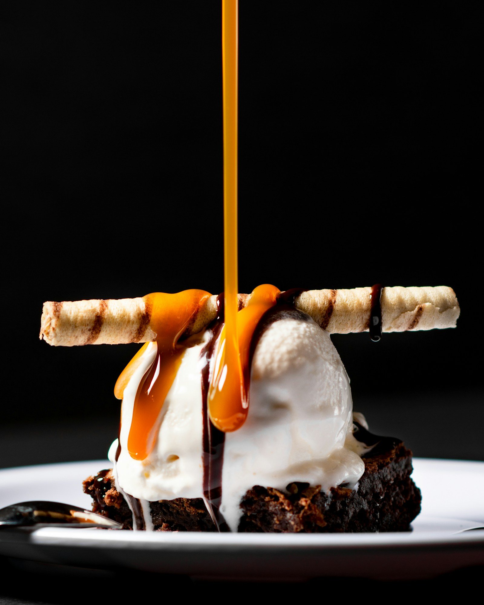 Warm caramel poured over a dessert
