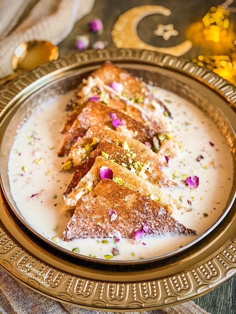 Shahi tukray with saffron rabri and pistachios